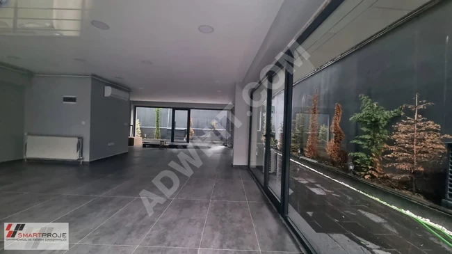 Empty shop with a spacious garden in a new building with an area of 80 square meters, close to the metro in the Nispetiye neighborhood.