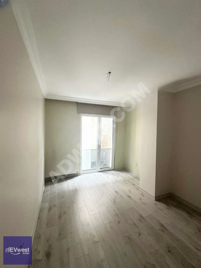 Empty apartment for sale on the middle floor within the Motif Garden complex - from EVwest