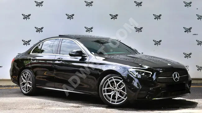 Mercedes - BenzE200D AMG-COMMAND موديل 2023 - نظام صوت BURMESTER- ابواب شفط - بدون طلاء- X-CLUSIVE