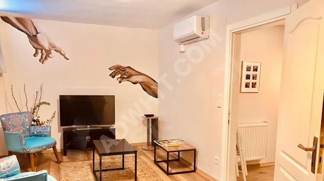 Garden floor apartment in Cihangir with a completely central location, fully renovated as if new, (2) air conditioners, combi heating system.