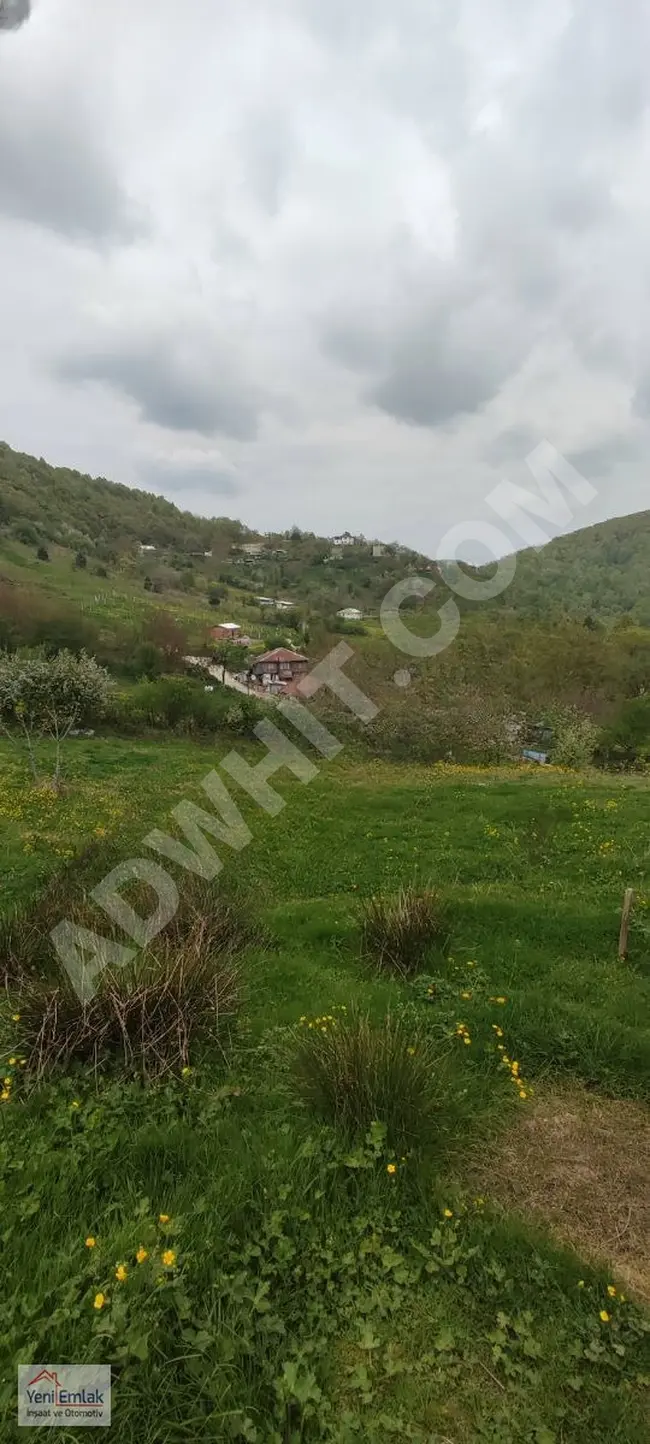 A residential land located 441m² away from İZNİK-OSMANİYE, planned with a road, water, and electricity in front of the door.