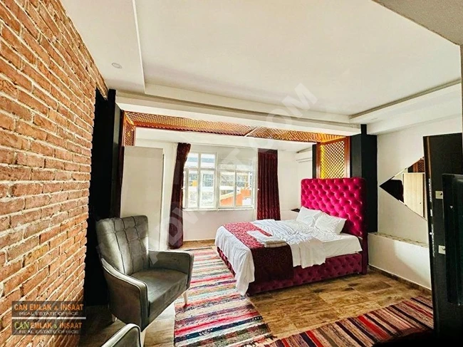 Studio apartment, 40m2, air-conditioned, fully furnished, with a high ceiling, in a renovated stone building, located in the center of Beyoğlu.