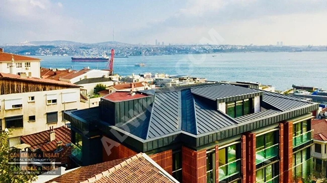 3+1 apartment with an area of 230m2, featuring two bathrooms, bright, well-maintained, with a stunning sea view, elevator, and parking space in Cihangir.