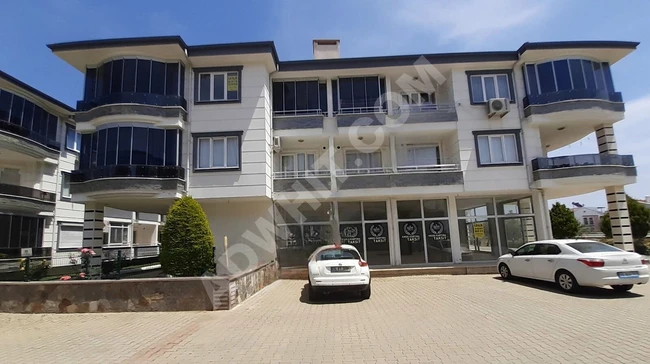 2+1 Apartment for sale in a residential complex with a swimming pool in Altınoluk - by Orhan Emlak