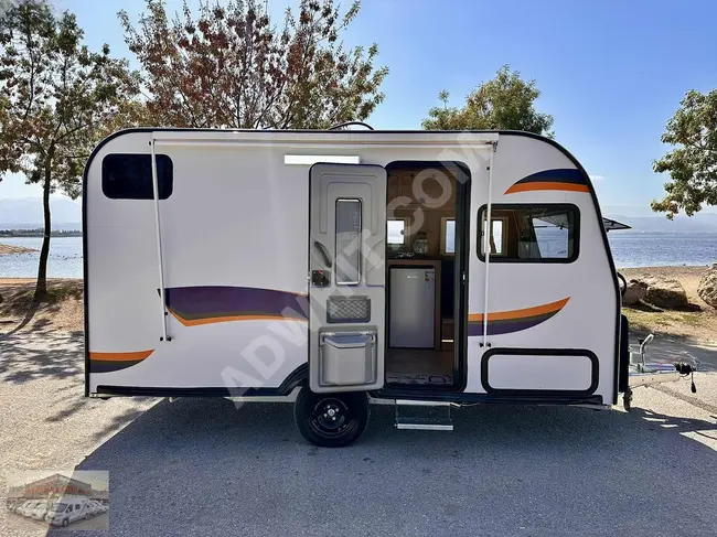 Caravan, with solar panels and an awning, Webasto for heating and cooling, TV, glass door ladder from GÖKHAN.