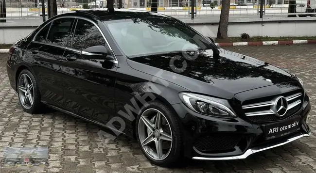 MERCEDES C 180 AMG موديل 2014 هيكل جديد - ب7 سرعات - سقف بانورامي - نظام ملاحة - تدفئة