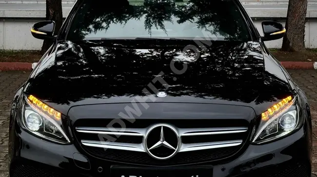 MERCEDES C 180 AMG موديل 2014 هيكل جديد - ب7 سرعات - سقف بانورامي - نظام ملاحة - تدفئة