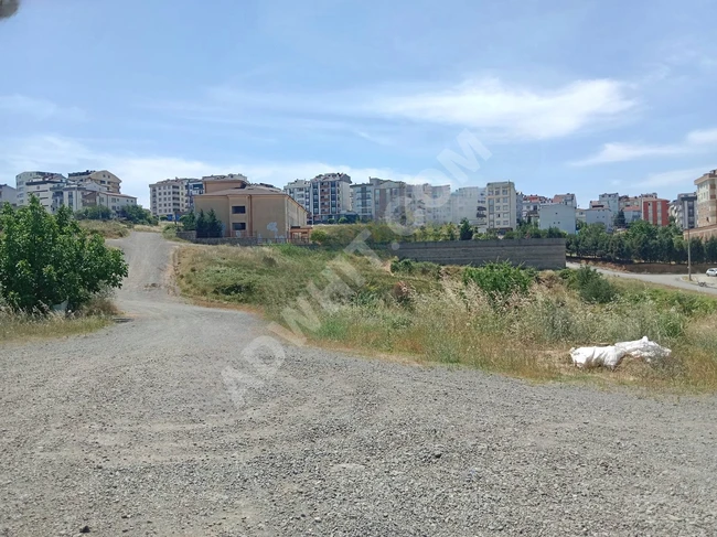 A plot of land near the government hospital under construction and close to social facilities.