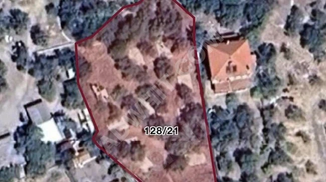 Land for sale, measuring 2396 square meters, located by the sea, in Kadirga village in Assos.