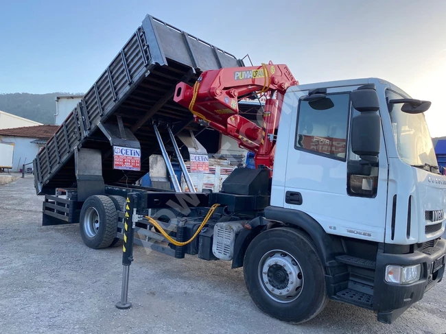 IVECO truck model 2010 equipped with a crane.