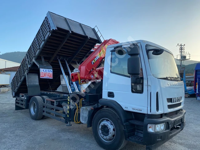 IVECO truck model 2010 equipped with a crane.