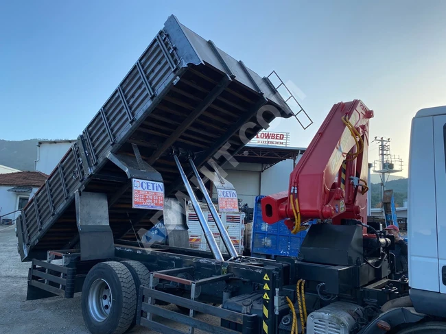 IVECO truck model 2010 equipped with a crane.