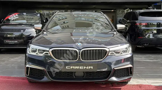 BMW 550d xDrive M SPORT Touring CARBON موديل 2018 بعداد 105.000 كم -CARENA