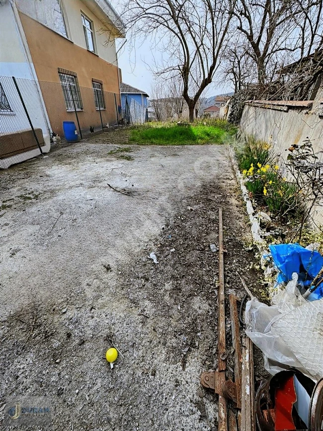 A plot of land measuring 310 square meters is located on Çavuşbaşı Street. The land is near the IETT bus station.