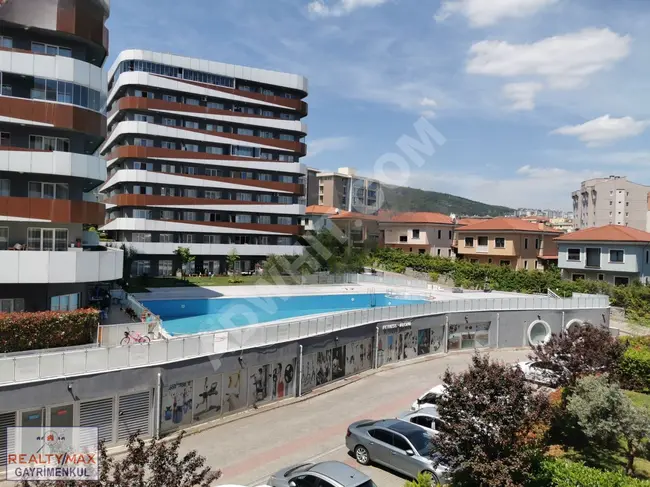 A spacious 1+1 apartment for rent, with a balcony, in the HELENİUM GARDEN complex, located in ÇAMLIK MAH.