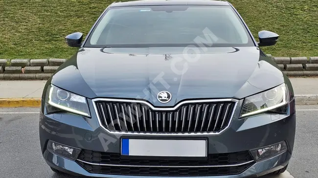 SKODA SUPERB 1.6 TDI PRESTIGE model 2018 with a glass roof, heating, and memory from Bİ MOTORS