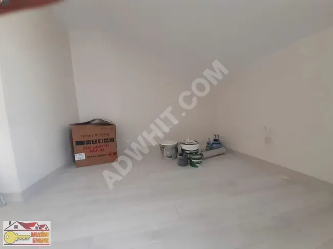 1+1 terrace floor apartment in a new building in HAZNEDAR