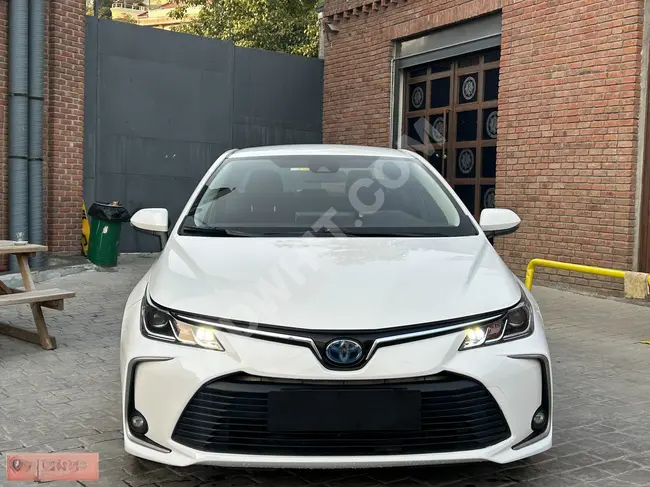 سيارة TOYOTA COROLLA  بدون طلاء / بدون  عيوب 2021  HYBRID DREAM / شحن لاسلكي / شاشة ديجتال / كاميرا رؤية خلفية