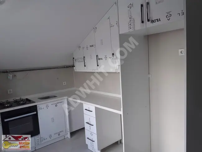 1+1 terrace floor apartment in a new building in HAZNEDAR