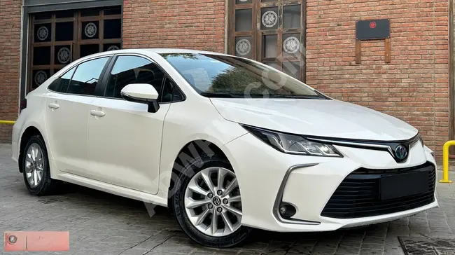 سيارة TOYOTA COROLLA  بدون طلاء / بدون  عيوب 2021  HYBRID DREAM / شحن لاسلكي / شاشة ديجتال / كاميرا رؤية خلفية