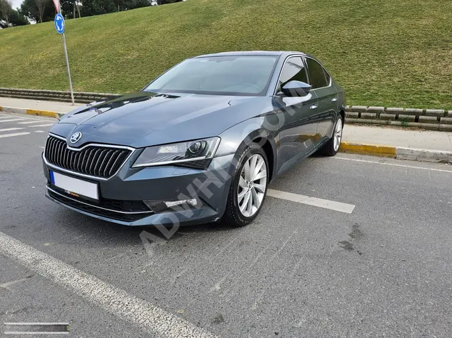 SKODA SUPERB 1.6 TDI PRESTIGE model 2018 with a glass roof, heating, and memory from Bİ MOTORS