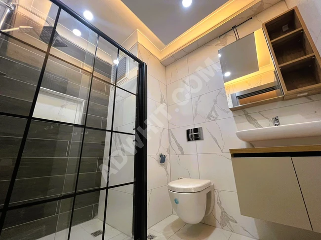 2+1 Apartment with a front facade on a mid-level floor, featuring a master bathroom from ALÇINAR EMLAK