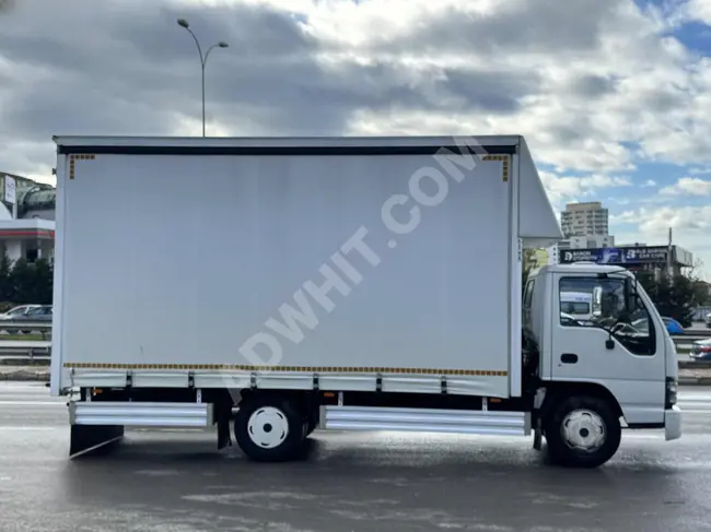 ISUZU NPR truck model 2009 with a movable cover from AZİZ