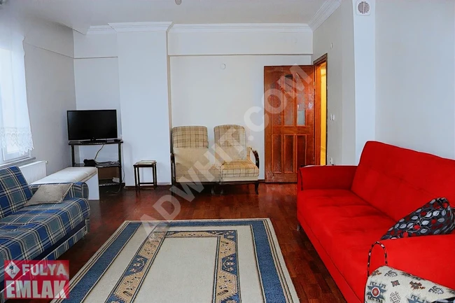 2+1 apartment for sale on Şairler Street, fourth floor with an elevator and natural gas heating system from Fulya Emlak.