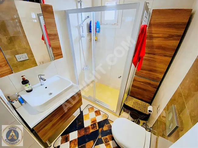 A 2+1 apartment in a secure residential complex with parking, featuring an en-suite bathroom and a stunning view in BİNEVLER.