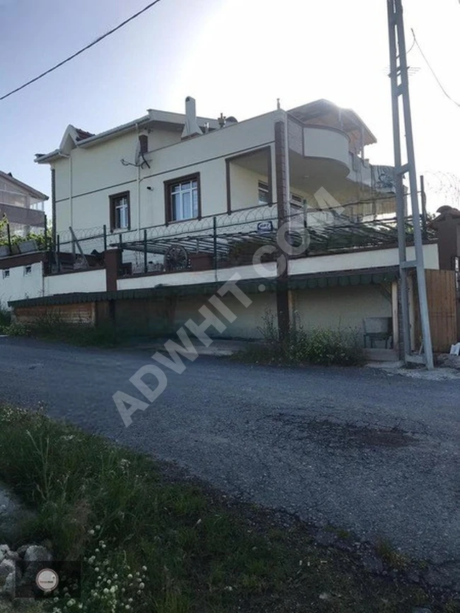 A holiday home consisting of three floors and 5 apartments for sale in Arnavutköy Yeniköy.