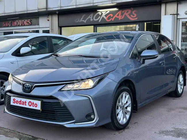 TOYOTA COROLLA 1.8 HYBRID DREAM model 2021, 20% tax, and option to pay with credit card in 12 installments