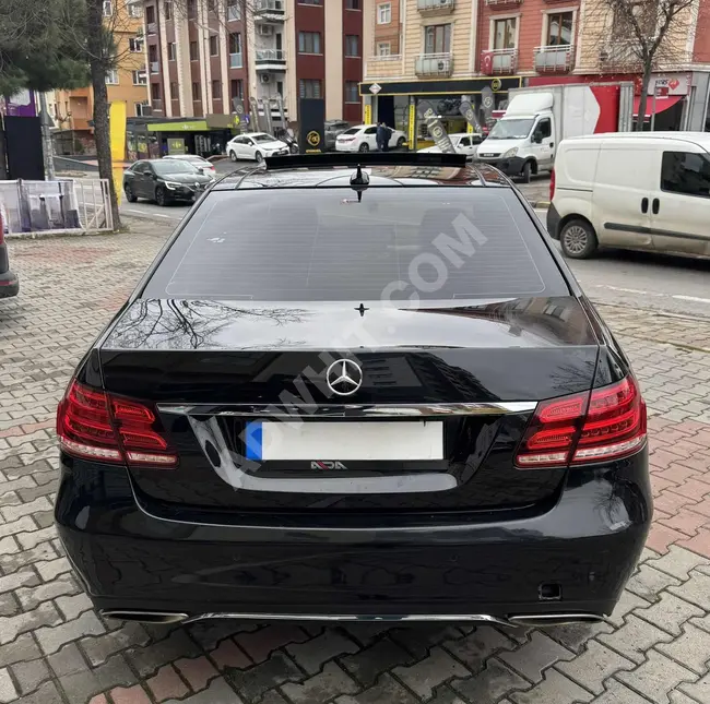 Mercedes - Benz E180 Model 2015 with a glass roof and a distinctive plate from ADA MOTORS