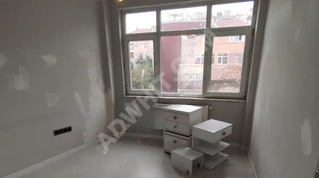 2+1 apartment with central heating system and two frontages in FATİH ŞEHREMİNİ