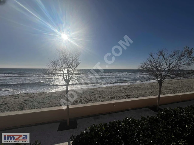 3+1 apartment with villa-style garden directly on the sea, with security in Kumburgaz