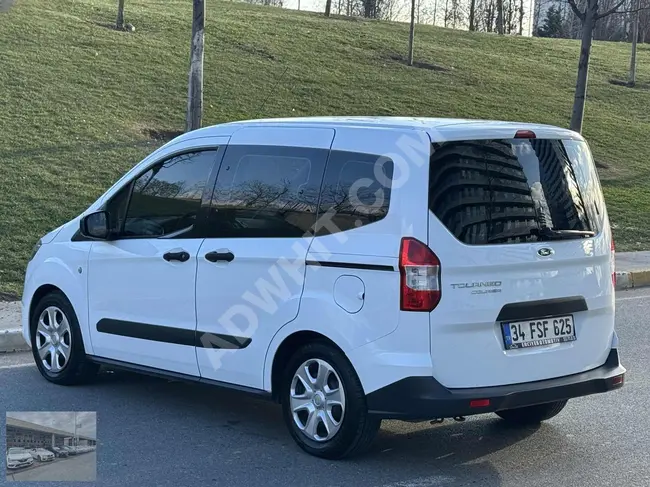 A 2022 Ford Tourneo Courier car that is clean and well-maintained with a license.