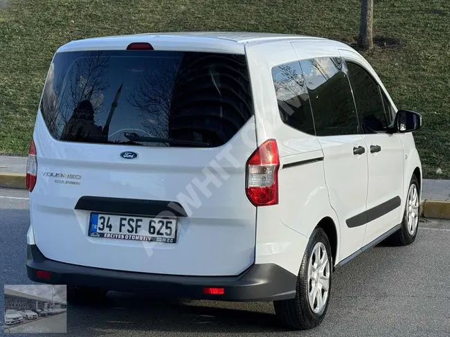 A 2022 Ford Tourneo Courier car that is clean and well-maintained with a license.