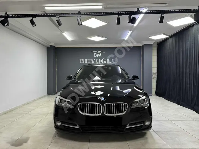 BMW 520i PREMIUM car, model 2014, with memory seats, digital gauges, and a vacuum door suction system.