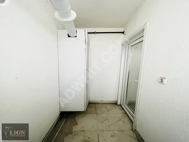 1+1 apartment for rent on a raised ground floor with a balcony by LION YAPI Real Estate.