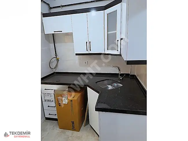 A 2+1 apartment on the ground floor for sale without interest in the Ninehatun neighborhood by Tekdemir Emlak.