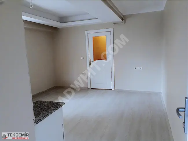 1+1 apartment with an American kitchen, elevated entrance, for sale suitable for a loan in the İnönü district.