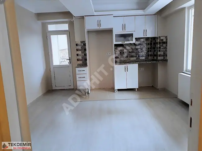 1+1 apartment with an American kitchen, elevated entrance, for sale suitable for a loan in the İnönü district.