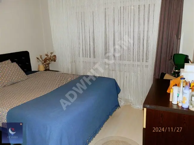 A spacious 2+1 apartment for sale in the EMLAK KONUT complex from Ayışığın.