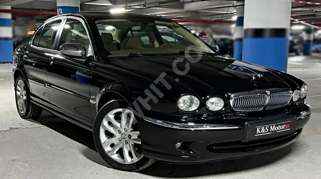 JAGUAR X-TYPE 2.1 V6 EXECUTIVE car, model 2007, with 107,500 km, featuring a touch screen.