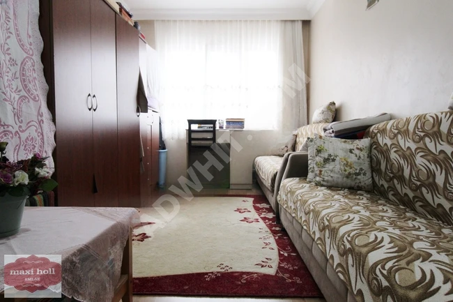 3+1 middle floor apartment with elevator in a new building for sale at MAXİ HOLL EMLAK