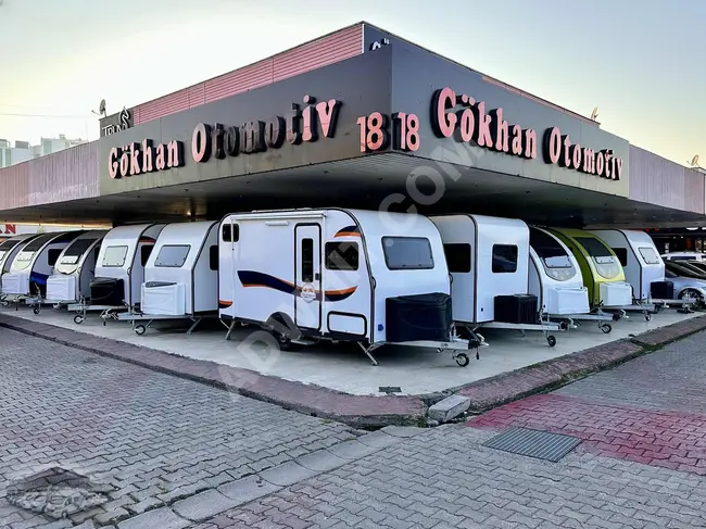 2024 Caravan from GÖKHAN KARAVAN equipped with a foldable bunk bed, solar panel, tent, Webasto heating system, TV, and toilet.