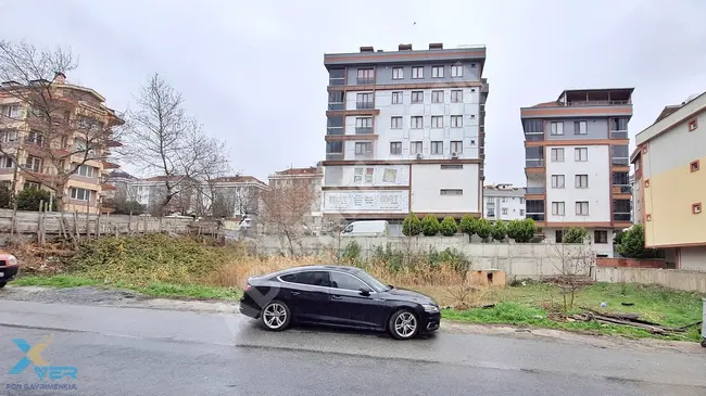 A plot of land designated for construction located in BEYLİKDÜZÜ, KAVAKLI neighborhood on the main road.