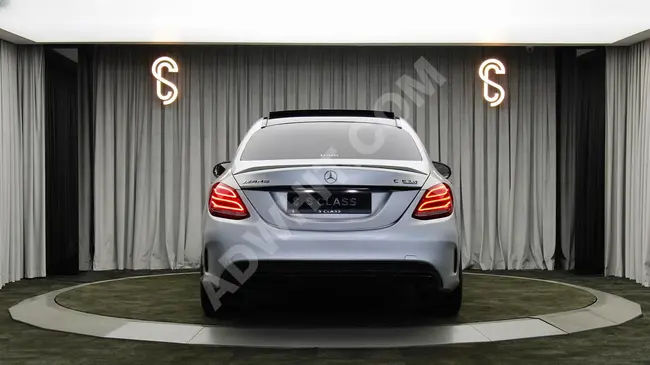 MERCEDES C63 S AMG car, 2015 model with 510 horsepower in matte gray color.