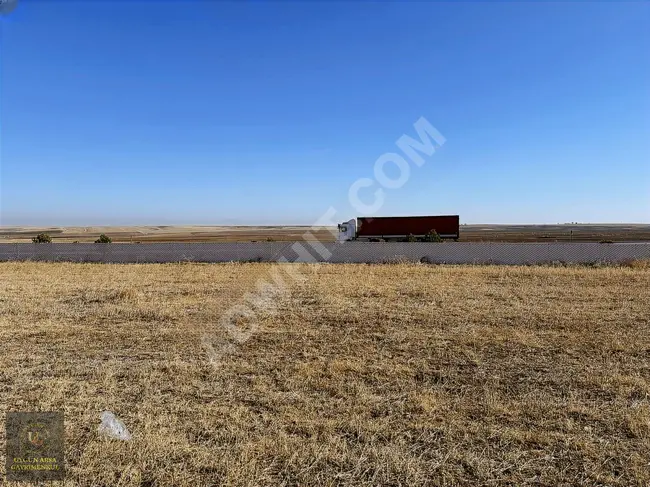 A suitable plot of land with an area of 49,233 square meters on the ESKİŞEHİR KONYA road frontage in AFYON EMİRDAĞ.