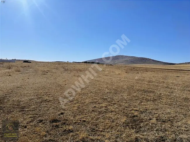 A suitable plot of land with an area of 49,233 square meters on the ESKİŞEHİR KONYA road frontage in AFYON EMİRDAĞ.