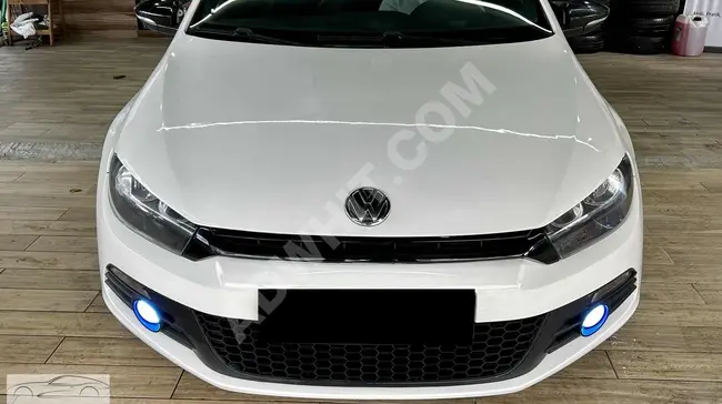 Financing opportunity for a 2010 model VW Scirocco with manual transmission and 160 horsepower. Installment available with a 2.71% monthly card rate.